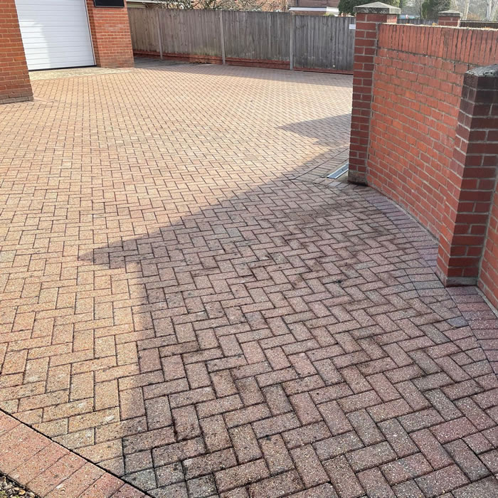 Clean pressure washed brickweave drive