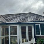 bungalow_corner_old_wooden_conservatory_moss_lichen_algea_covered_roof_700x