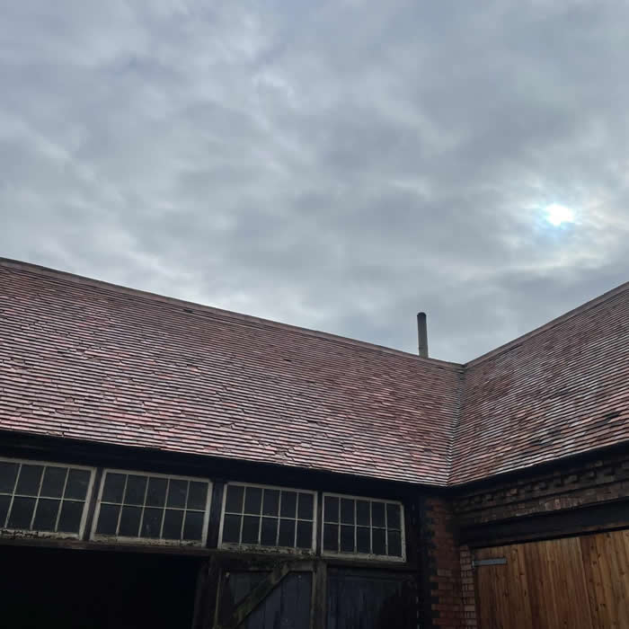 Commercial outbuildings after moss removal and roof steam cleaned in Holt, Norfolk