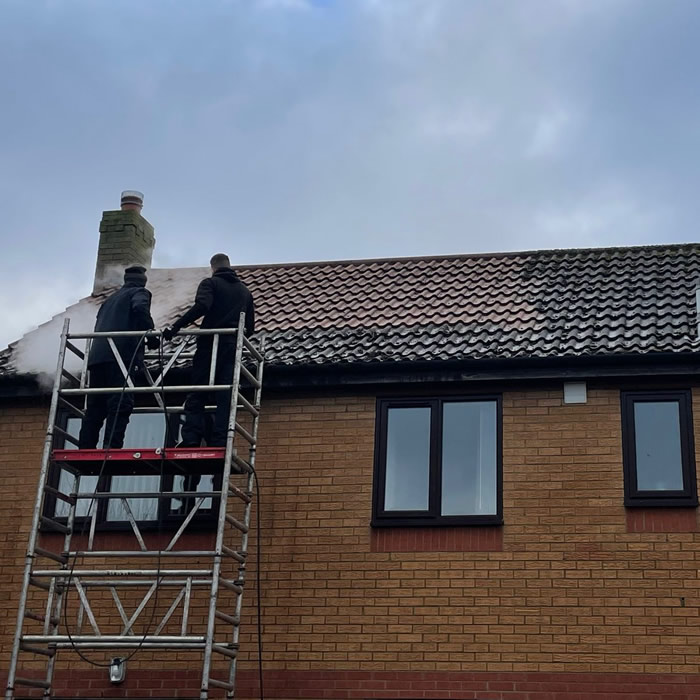 Safely steam clean a modern home roof using scaffolding tower in attleborough Norfolk